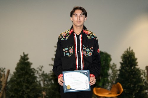 Tayden Shott poses with Council's Excellence Award for Youth. Image via https://www.rmwb.ca/en/mayor-council-and-administration/councils-excellence-awards.aspx