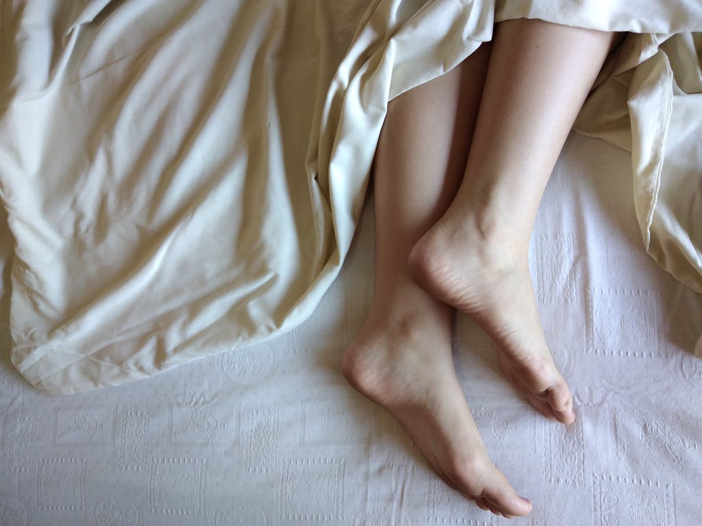 Feet on Bed